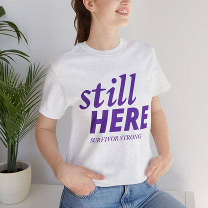 Still Here Tee – Survivor Strong Edition